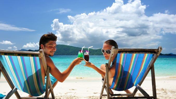 Couple on a beach is roi unlimited a scam